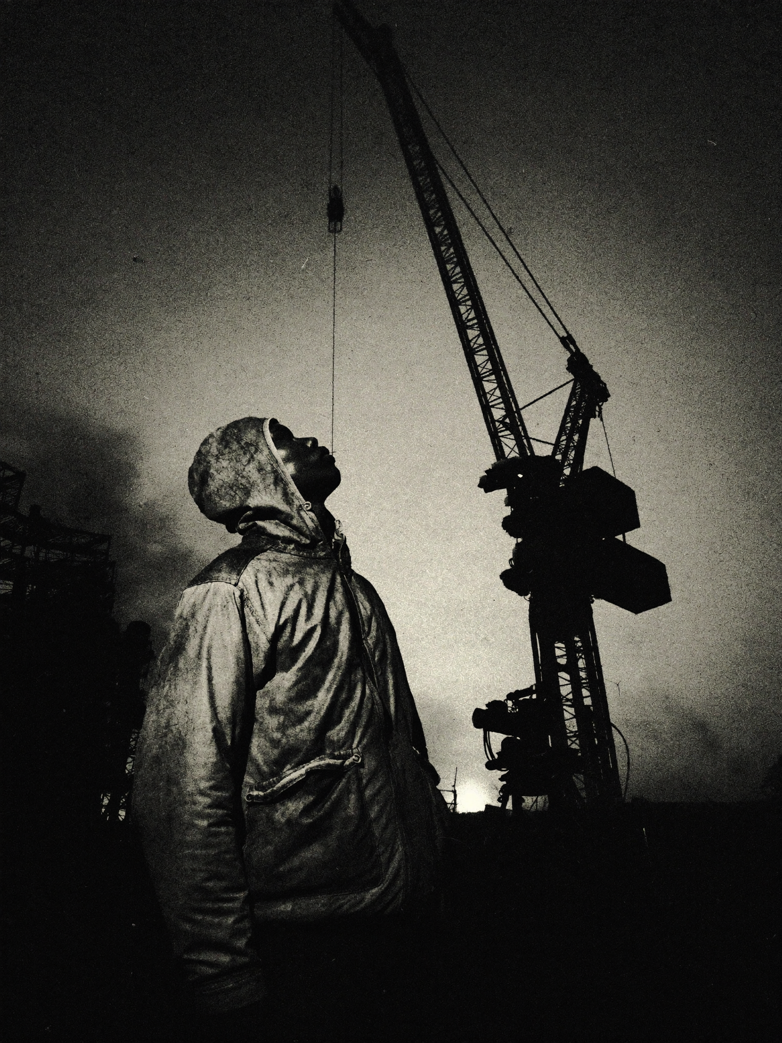 A filmmaker on set, shot from a low heroic angle